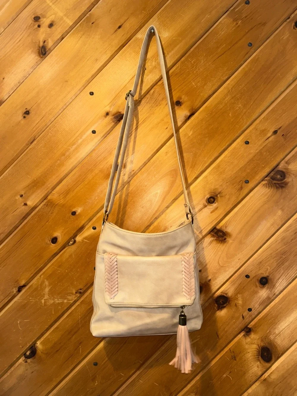 Western style tan crossbody bag with braided & tassels accents